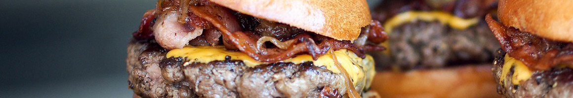 Eating American (Traditional) Burger at Oskar Blues Grill & Brew restaurant in Lyons, CO.